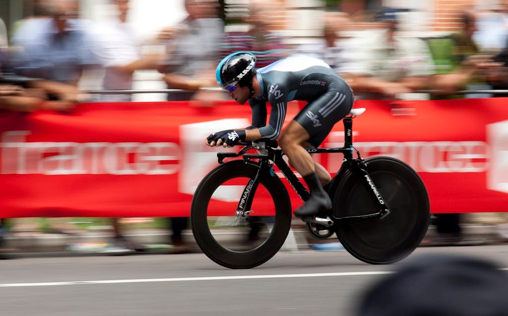 Dynamic shot of a cyclist competing in a fast-paced cycling event, showcasing speed and athleticism.